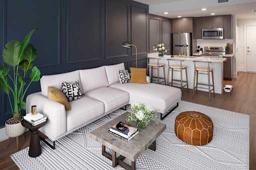 A modern living room with a white sofa and a grey coffee table at The Fitz Apartments,Portland, Oregon