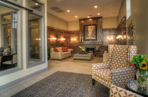 Liberty Gateway Apartments, Salt Lake City, Utah, lobby area with a fireplace and a painting above it.
