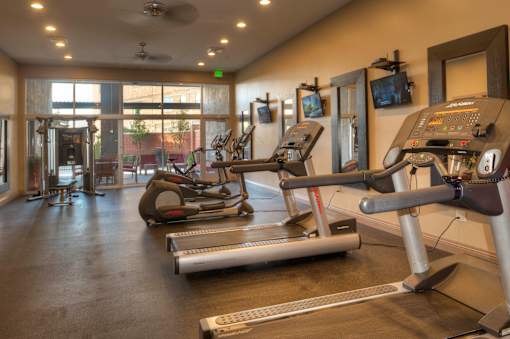 Liberty Gateway Apartments, Salt Lake City, Utah, fitness center with treadmills, elliptical machines and other exercise equipment.