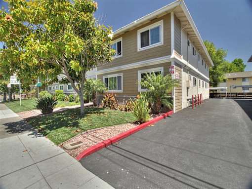 a house with a red curb in front of it