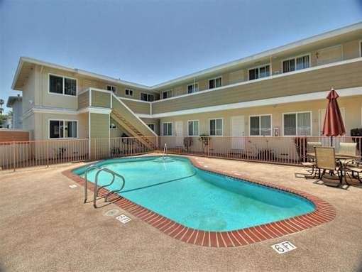 a resort style pool is in the middle of a building