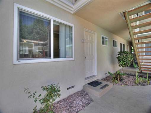 the front door of a house with a white door