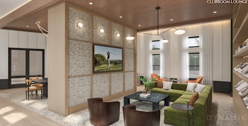 A modern living room with a green couch and a wooden floor.