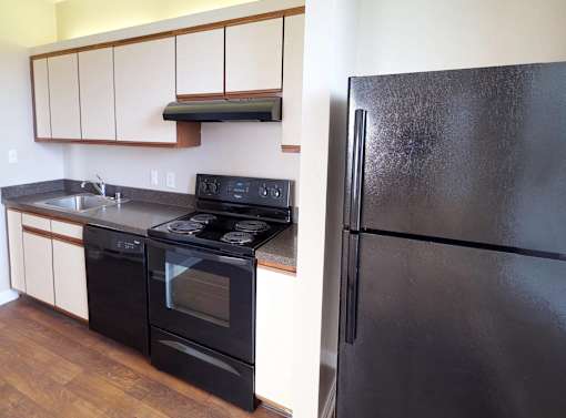 Kitchen With Black Appliances at The Mount Royal, Maryland