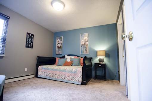 Spacious bedroom at Mason Hills Apartments in Mason, MI