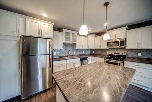 Beautiful White Cabinets Kitchen in Lansing Apartments