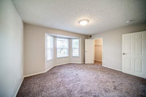 Carpeted Bedroom with Bay Window
