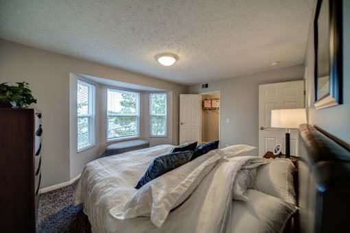 Spacious bedroom in Lansing Apartments with bay window
