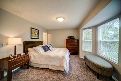 Spacious bedroom in Lansing Apartments with bay window