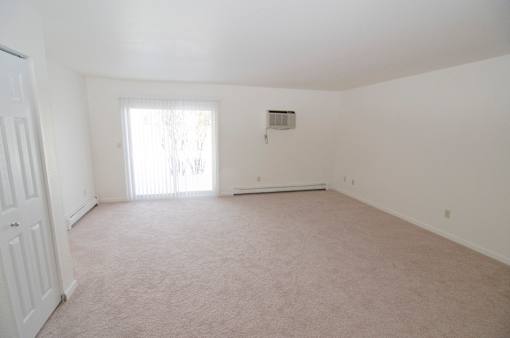 Living room at Whispering Pines Apartments in Holland, Michigan