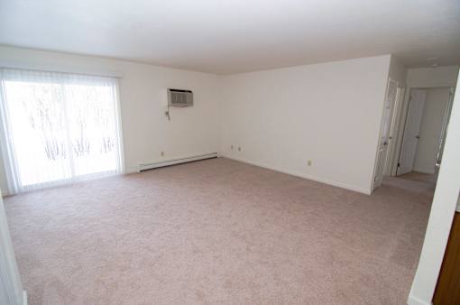 Living room at Whispering Pines Apartments in Holland, Michigan