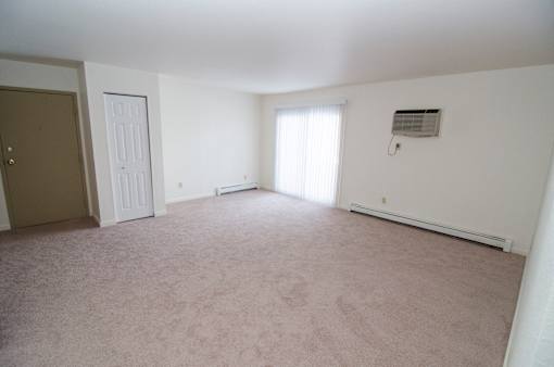 Living room at Whispering Pines Apartments in Holland, Michigan