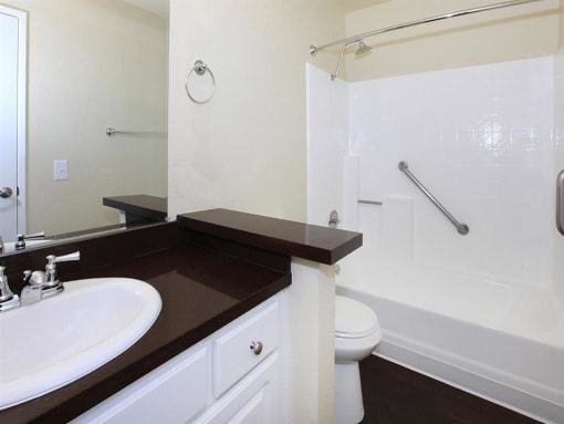 View of bathroom vanity and bathtub