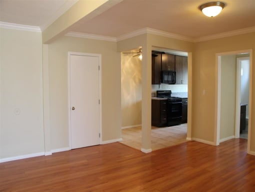 Entrance of unit with view of kitchen and front door