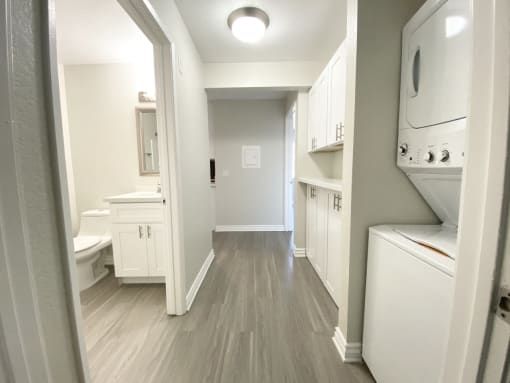 View of laundry with bathroom and storage