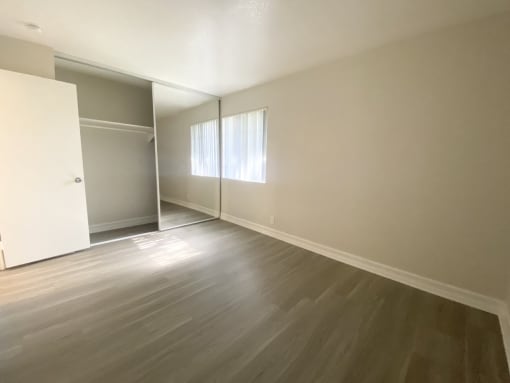 Bedroom with another view of closet
