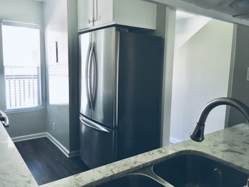 Diwhwasher, Fridge In Kitchen at Wilbur Oaks Apartments, Thousand Oaks, California