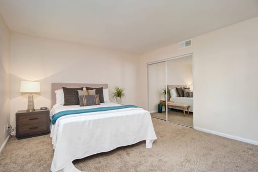 Table Lamp, Pillow In Bedroom at Wilbur Oaks Apartments, Thousand Oaks, CA