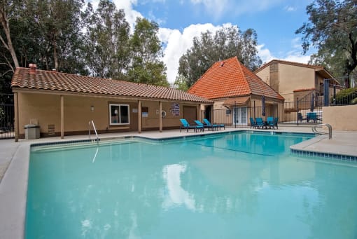 Swimming Pool And Relaxing Area at St. Charles Oaks Apartments, Thousand Oaks, CA