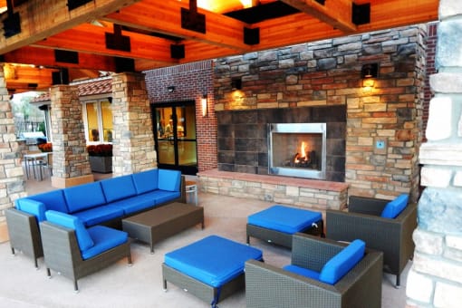 Beautiful Outdoor Lounge with Couches & Fireplace at Longmont CO Apartment Near Boulder