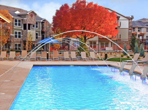 Outdoor Heated Swimming Pool and Sundeck to Tan and Lounge at Pet Friendly Apartments Near Fort Collins