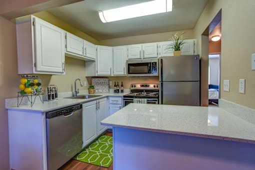 Room with kitchen at Commons at Hawthorn Village Apartments, Hillsboro, OR