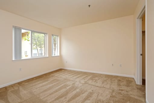 Bedroom with wooden floor at Redwood Commons Apartments, Oregon 97128