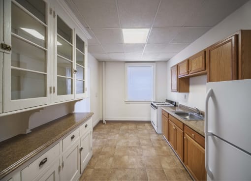 Fully Equipped Kitchen With Ample Storage at Willett Apartments, Albany, New York