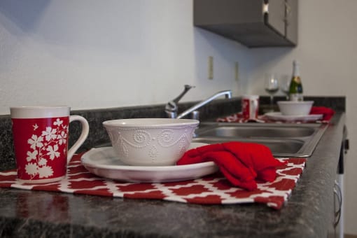 Sage Creek Apartments bowl with red towel decoration
