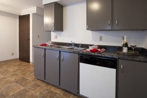 Sage Creek Apartments kitchen with grey cabinets
