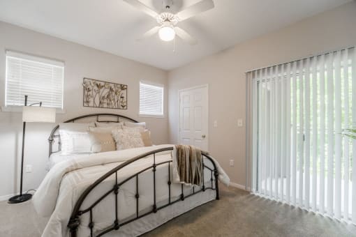 Bedroom with walk-in closet and private patio  at Edgewood Village, Lewisville, TX