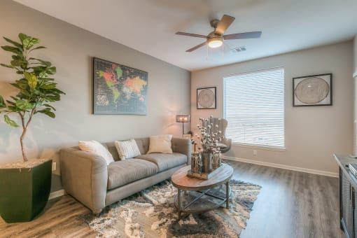 living room with couch and coffee table  at EdgeWater at City Center, Lenexa, KS