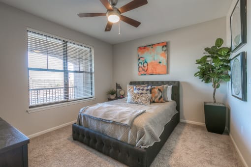 bedroom with ceiling fan and window view  at EdgeWater at City Center, Kansas, 66219