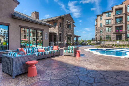 hot tub with couch and clubhouse in background  at EdgeWater at City Center, Kansas, 66219
