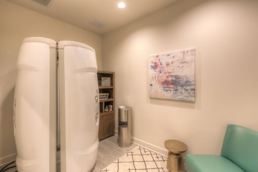 tanning room with a chair and a stand up tanning machine  at Waterside Residences on Quivira, Kansas, 66215