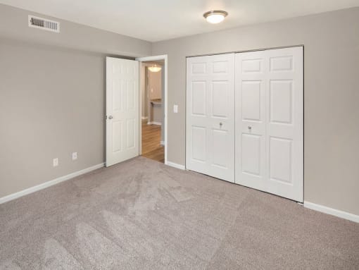Carpeted bedrooms at Burwick Farms apartment homes