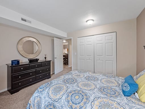 carpeted bedroom with large closet at burwick farms