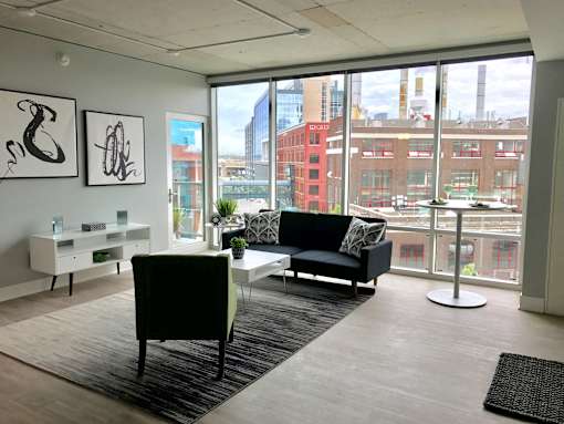 Spacious Living Room with Large Windows Venue Tower Apartments