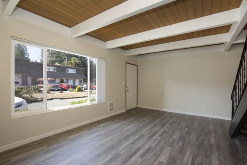 Living Space with Exposed Overhead Beams at Woodlake Townhomes, Edmonds, WA, 98026