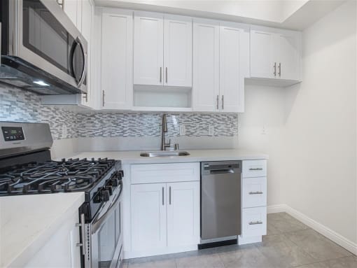 Fully Equipped Kitchen Includes Frost-Free Refrigerator, Electric Range, & Dishwasher at Hollywood Vista, Hollywood, California