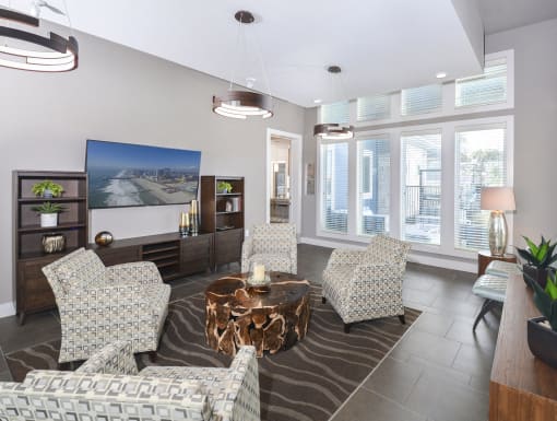 Modern resident retreat with expansive windows, elegant décor, and versatile spaces for socializing or unwinding.