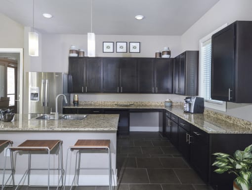 Open-concept kitchen with generous prep space, modern finishes, and a large breakfast bar perfect for entertaining.