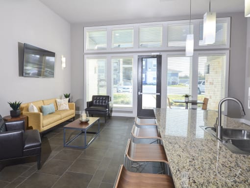 Stylish resident lounge offering comfortable seating, modern finishes, and inviting spaces to relax, work, or socialize.