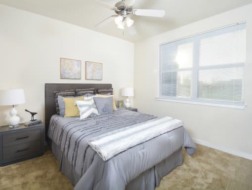 Modern bedroom with a clean layout, cozy bedding, and a bright, relaxing atmosphere.
