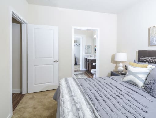 Modern bedroom with a clean layout, cozy bedding, and a bright, relaxing atmosphere.