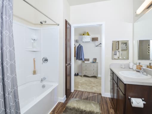 Spacious bathroom featuring an oversized vanity, abundant cabinet storage, and a clean, contemporary design.
