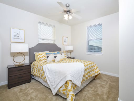 Functional bedroom with a modern bunk bed, built-in storage, and a cozy layout perfect for flexible living.