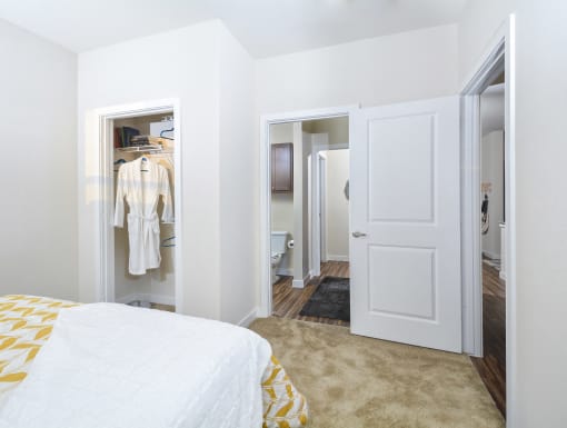 Comfortable bedroom retreat with soft carpeting, ample closet storage, and a bright, airy design.he Terrace at Walnut Creek, Texas