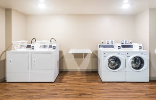 Springville Seniors Apartments Coomunity laundry room with 2 washers and 2 dryers