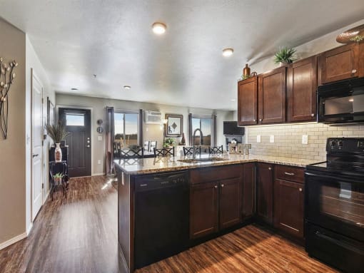 Kitchen with Granite Counters and Breakfast Bar